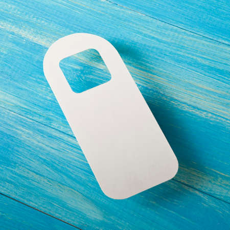 White door hanger on a blue wooden planks