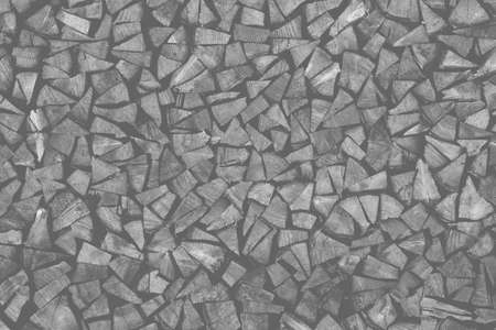 Dry chopped firewood logs ready for winter as background or textureの写真素材