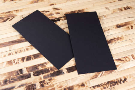 Blank flyer over wooden background to replace your designの写真素材