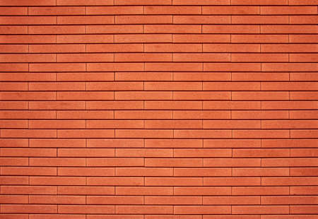 Empty red brick wall textured backgroundの写真素材