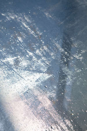 Water drops on old metal. Can be used as a texture or backgroundの写真素材