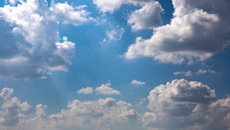 Blue sky with white clouds. Beautiful sky background. Clear day and good weather.