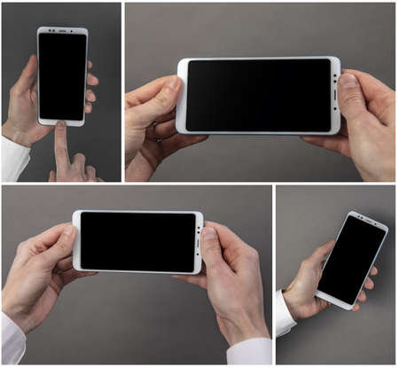 Man's hand holding black screen mobile phone