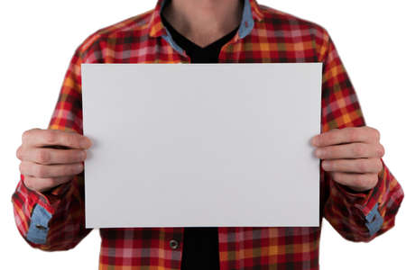 A man in a colored shirt holding a white letterhead