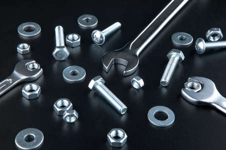 Nuts and bolts closeup on black background