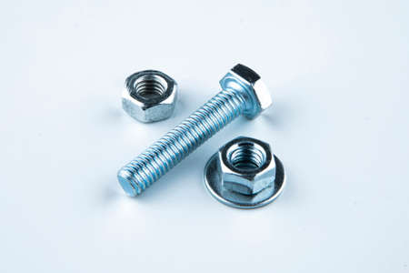 Nuts and bolts closeup on white background