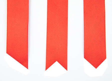 Shiny red ribbons on white background with copy space