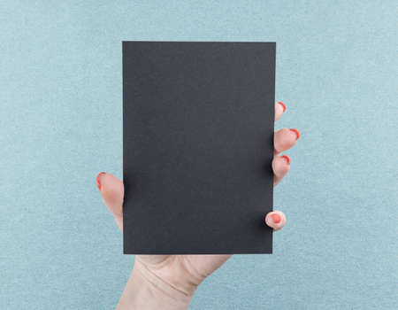 A woman holding black booklet. Identity template