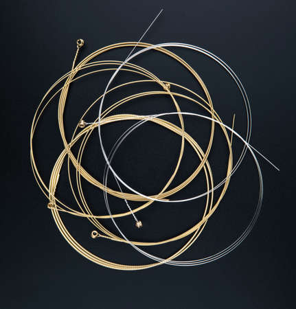 Electric guitar strings isolated on black backgroundの写真素材