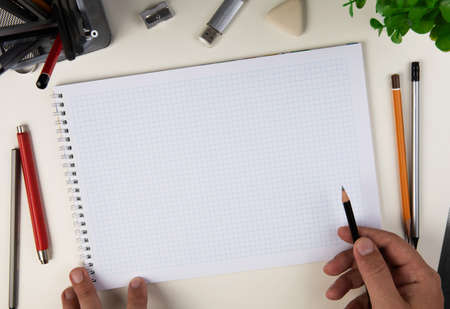 Human hand with pencil prepare to writing on notebookの写真素材