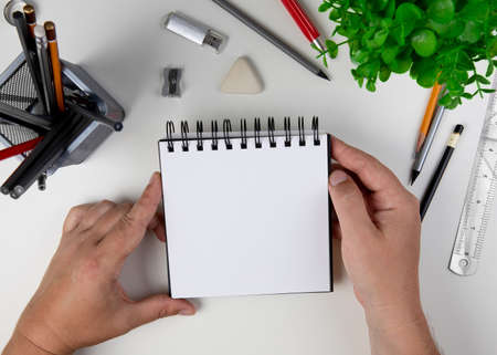 Human hand with pencil prepare to writing on notebook