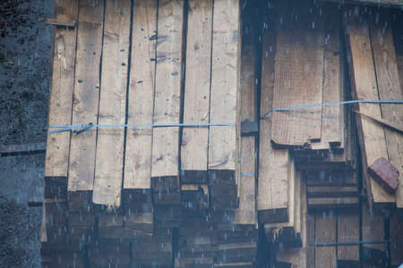Stack of wooden boards on construction siteの写真素材