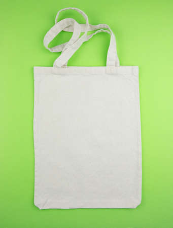 White shopping bag on the green backgroundの写真素材