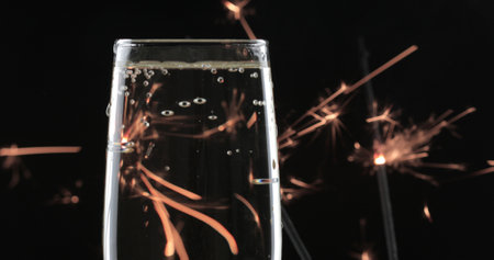 Pouring champagne into a glass. Blurred backgroundの写真素材