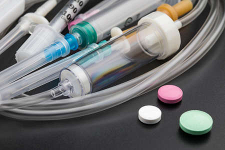 Health care concept: pills, drugs and syringes