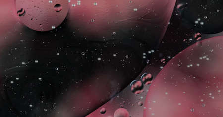 Oil bubbles on water abstract form in glass tank