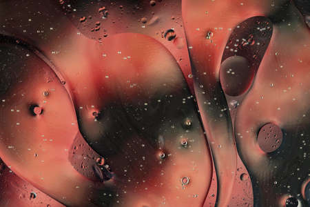Oil bubbles on water abstract form in glass tank