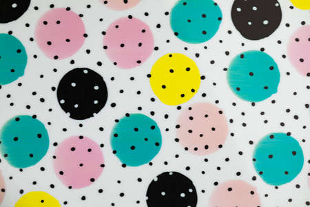 Colorful dots view from above on a light backgroundの写真素材