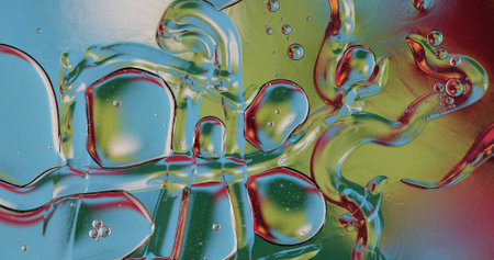 Oil bubbles on water abstract form in glass tank