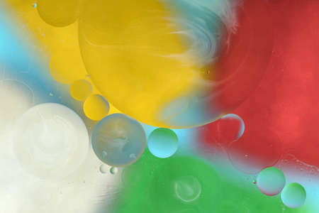 Oil bubbles on water abstract form in glass tank