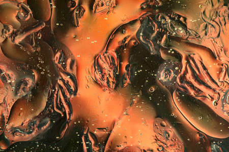 Oil bubbles on water abstract form in glass tank
