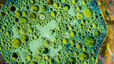 Oil bubbles on water abstract form in glass tankの写真素材