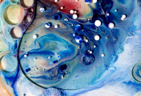 Oil bubbles on water abstract form in glass tank