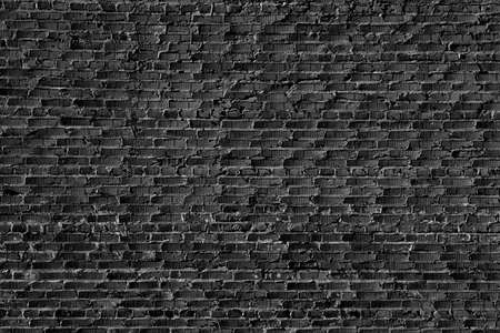 A grungy brick wall texture as backgroundの写真素材