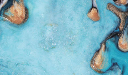 Beautiful acrylic color abstract background. Colored marble mixed ink abstraction.の写真素材