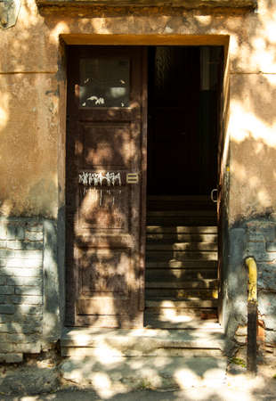 Legacy old-fashioned front door on the entrance wall.