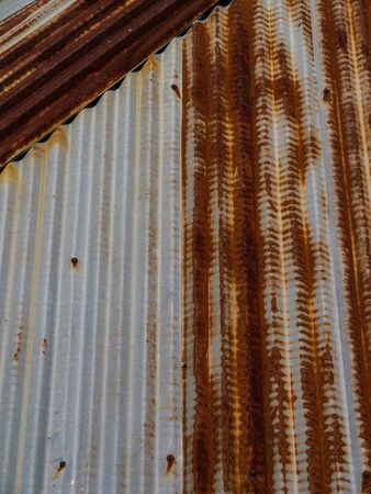 Old galvanized iron roof of a house in Thailandの写真素材