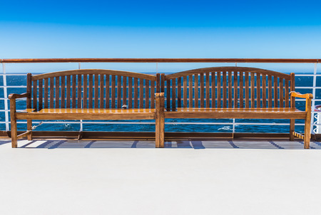 The two wooden benches on deck of the cruise ship