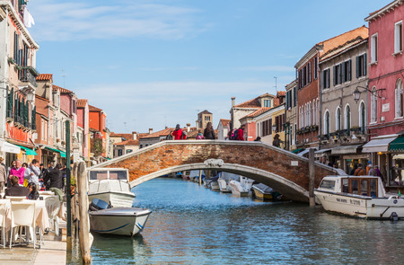VENICE, ITALY - OCTOBER 17, 2015: The view of Murano lives beside the canal in Murano Island, Venice, Italyのeditorial素材