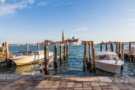 VENICE, ITALY - OCTOBER 17, 2015: Water taxis dock at the port along Grand Canal near San Marco water bus stop in Venice, Italyのeditorial素材