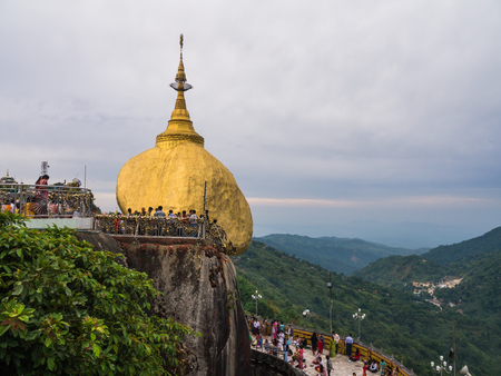 Mon State, Myanmar - April 15, 2017: Unidentified Buddhists pray at Kyaiktiyo Pagoda, Golden Rock in Mon State, Myanmarのeditorial素材