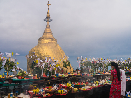Mon State, Myanmar - April 15, 2017: Unidentified Buddhists pray at Kyaiktiyo Pagoda, Golden Rock in Mon State, Myanmarのeditorial素材