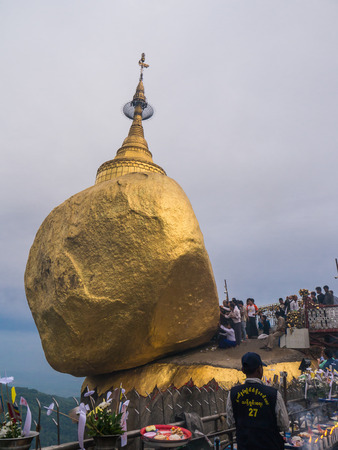 Mon State, Myanmar - April 15, 2017: Unidentified Buddhists pray at Kyaiktiyo Pagoda, Golden Rock in Mon State, Myanmarのeditorial素材