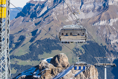 Engelberg, Switzerland - October 16, 2016: Unidentified tourists sit on Ice Flyer at Mount Titlis in Engelberg, Switzerlandのeditorial素材