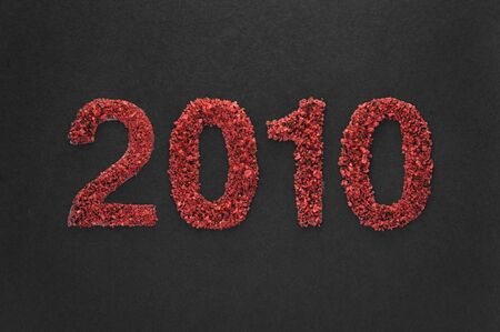 2010 new year written in sand textureの写真素材