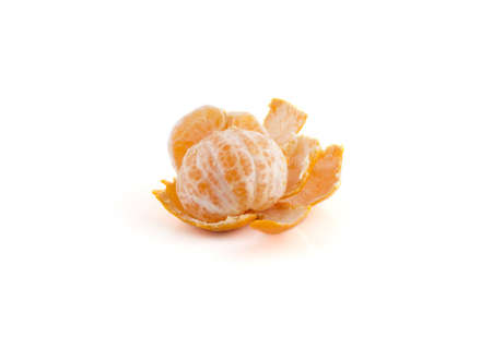 A mandarin is peeled on a white background.の写真素材