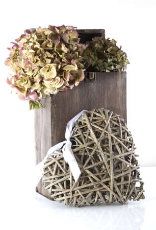 Heart shaped decoration at a white background.の写真素材