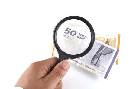Checking the money on a white background.の写真素材