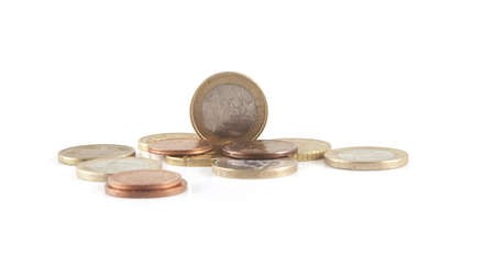 Multiple euro coins on a white background.の写真素材