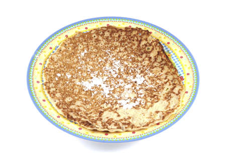Single pancake on a plate on a white background.の写真素材