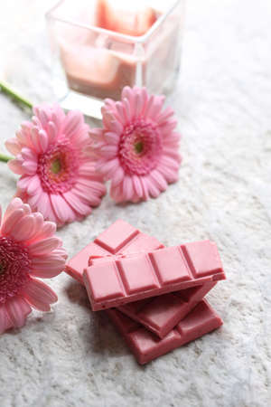 A plate of pink chocolate. A plate of pink chocolate.