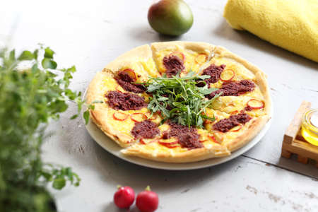Vegetarian pizza with vegetables, green arugula and tomato pulp. Horizontal frameの写真素材