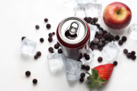 A refreshing, fresh juice cocktail made of red fruit, strawberries, blackcurrant, apple. Composition of fruit and ice cubes. Top viewの写真素材