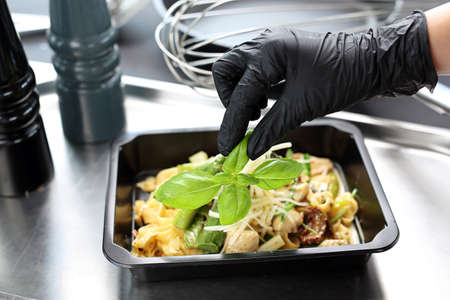 Box diet. The cook prepares take-out dishes. Catering. Takeaway food in a box.