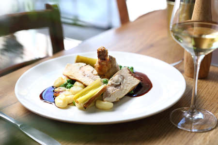 Delicate chicken meat served with dumplings, green peas and sauce. Proposal proposal, menu. Horizontal compositionの写真素材