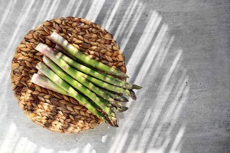 Composition of fresh green asparagus on a natural background, horizontal composition with space for text.の写真素材